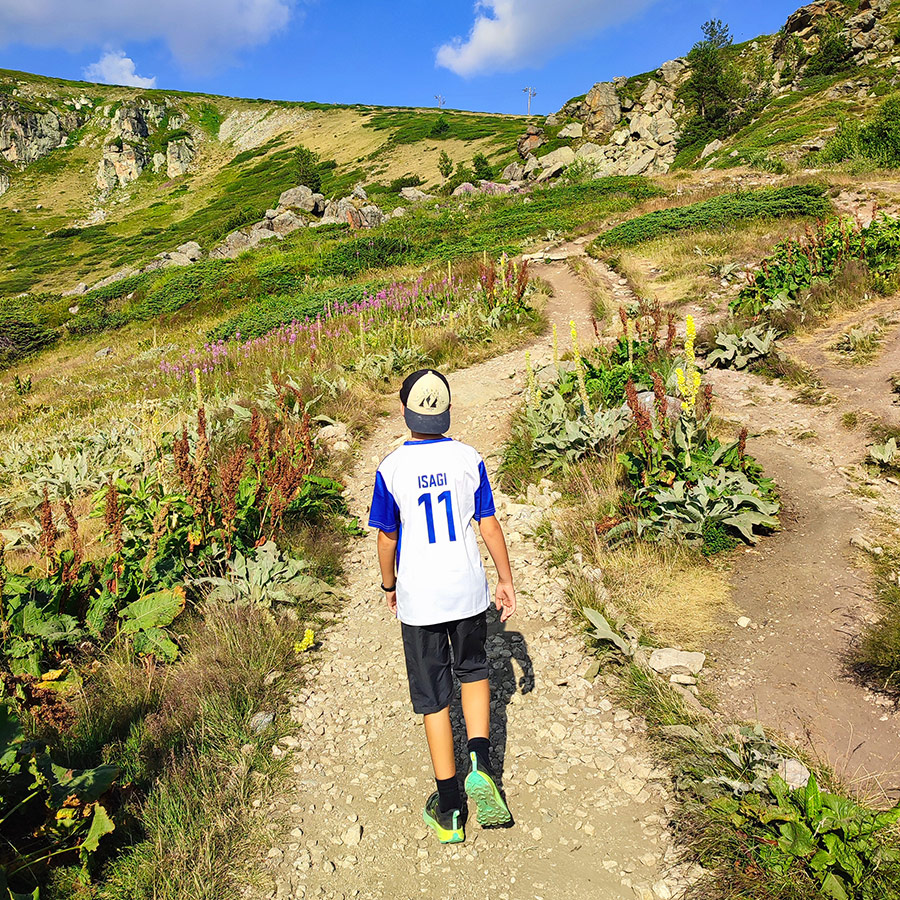 Young hiker on the trail to Seven Rila Lakes in Bulgaria.