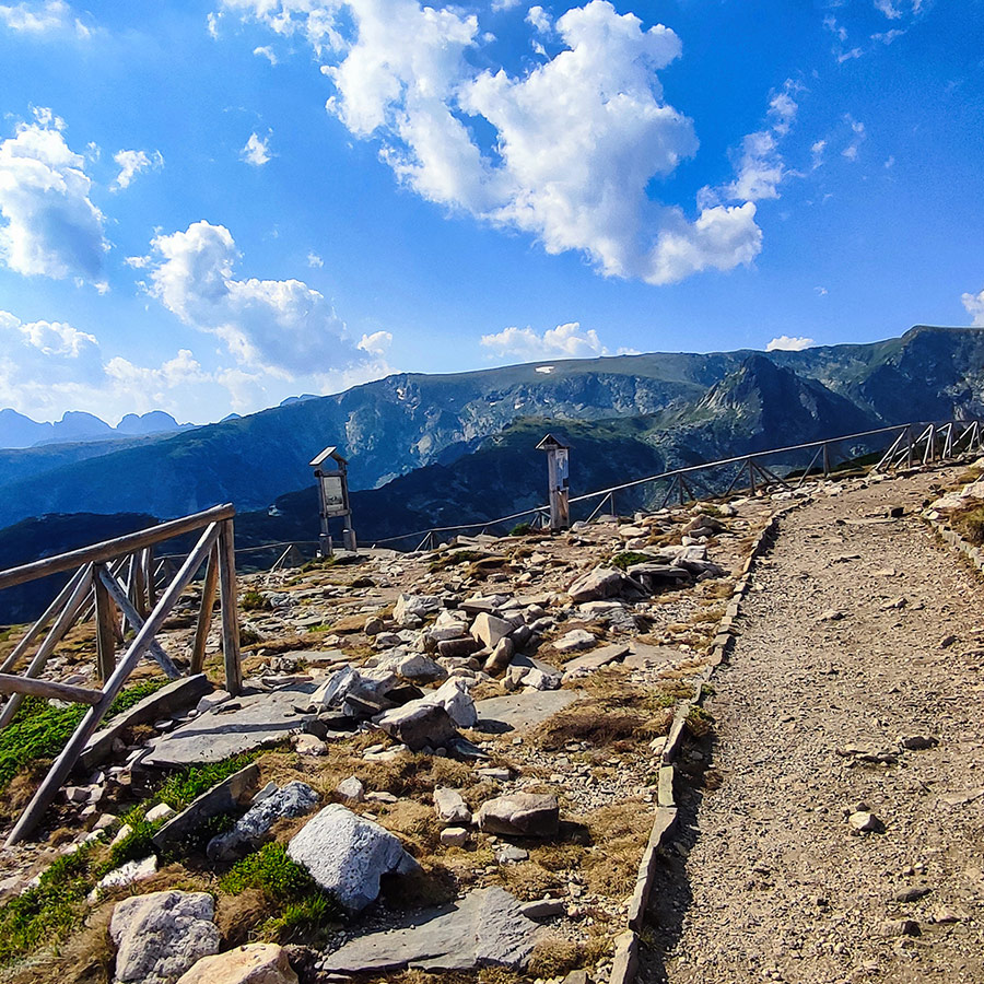 Wooden railings along the mountain path to the Seven Rila Lakes viewpoint.