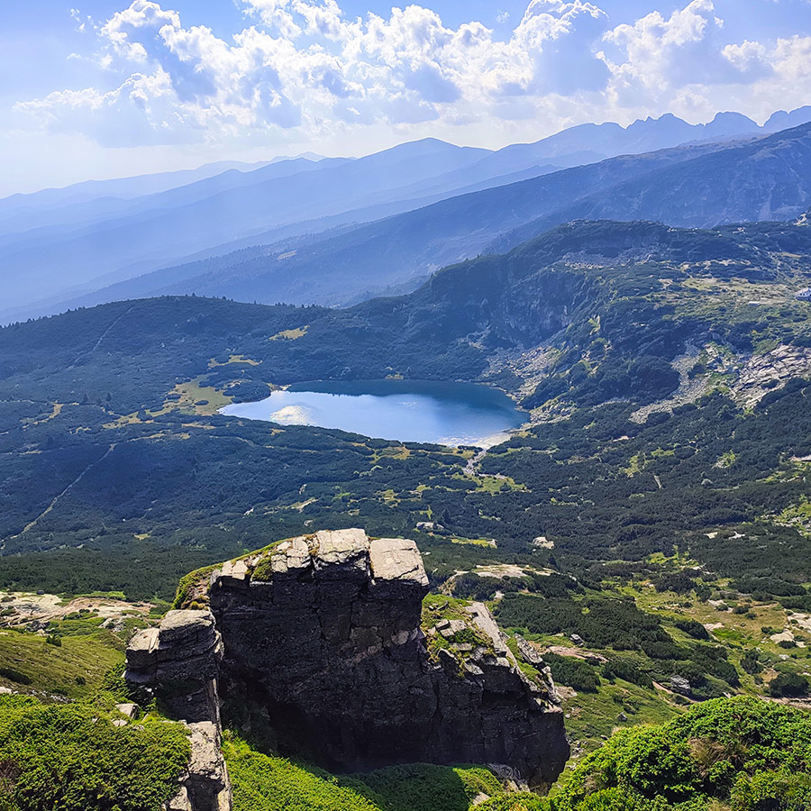 Rocky cliffs above a glacial lake in Rila National Park, Bulgaria.