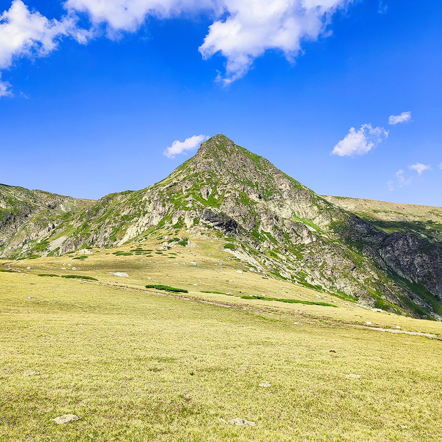 Mountain peak rising above the alpine meadows in the Seven Rila Lakes area, Bulgaria.