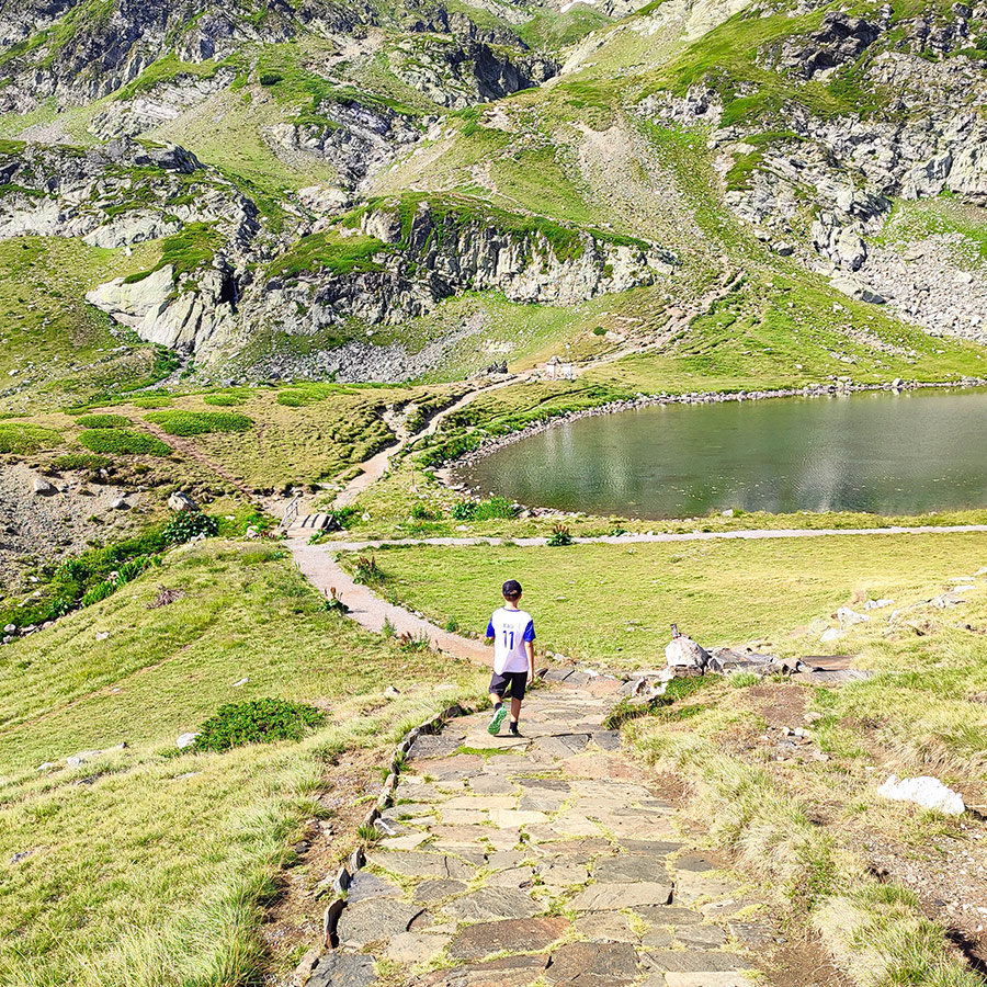 Young Hiker hiking along the trail near the Seven Rila Lakes in Bulgaria.