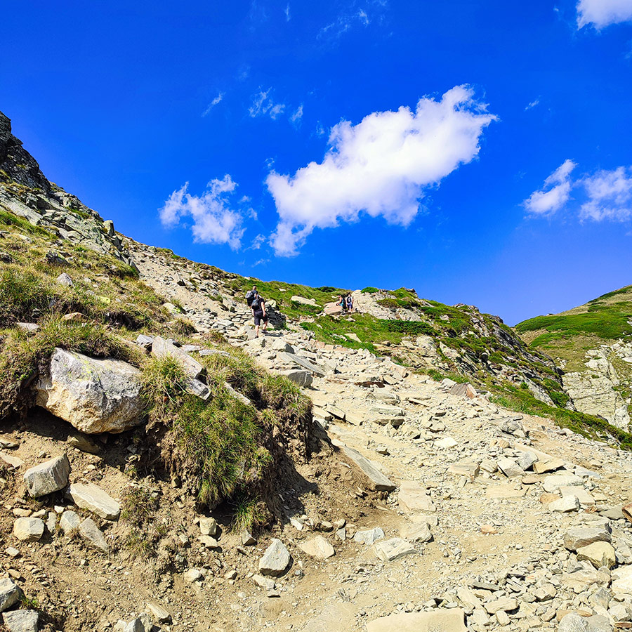 Hikers moving along the trail in the Seven Rila Lakes, Bulgaria.