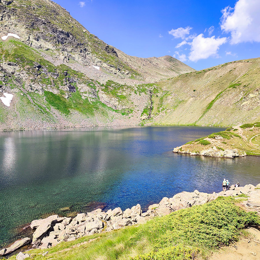 Alpine lake surrounded by rocky slopes, Seven Rila Lakes, Bulgaria.