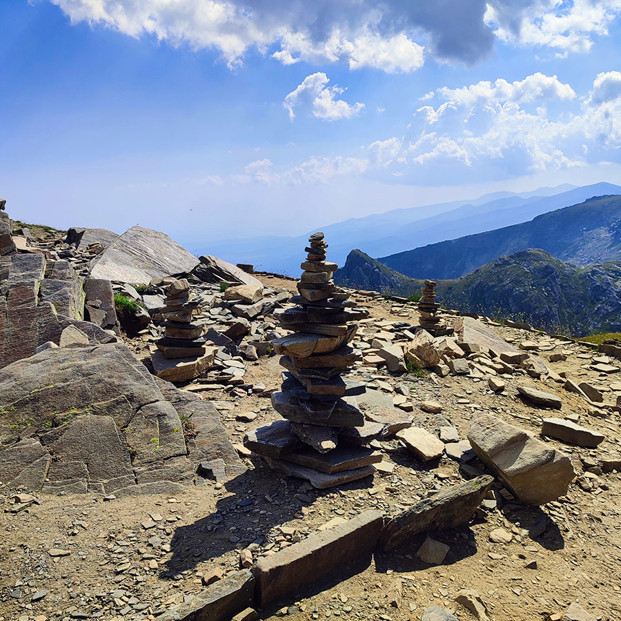 Stacked rock cairns on a viewpoint above the Seven Rila Lakes, Bulgaria.