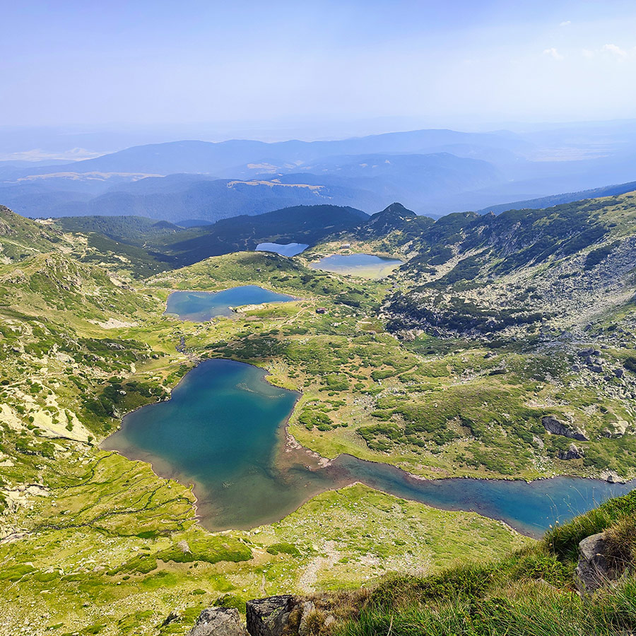 Multiple alpine lakes of the Seven Rila Lakes viewed from a high ridge.