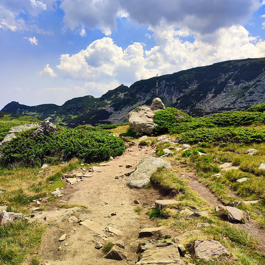 Rocky hiking trail leading towards the Seven Rila Lakes in Bulgaria.