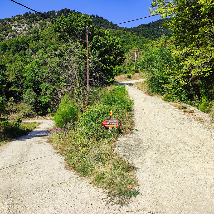 Hiking trail intersection with direction sign to Anthochori Waterfall, Agrafa, Karditsa, Greece