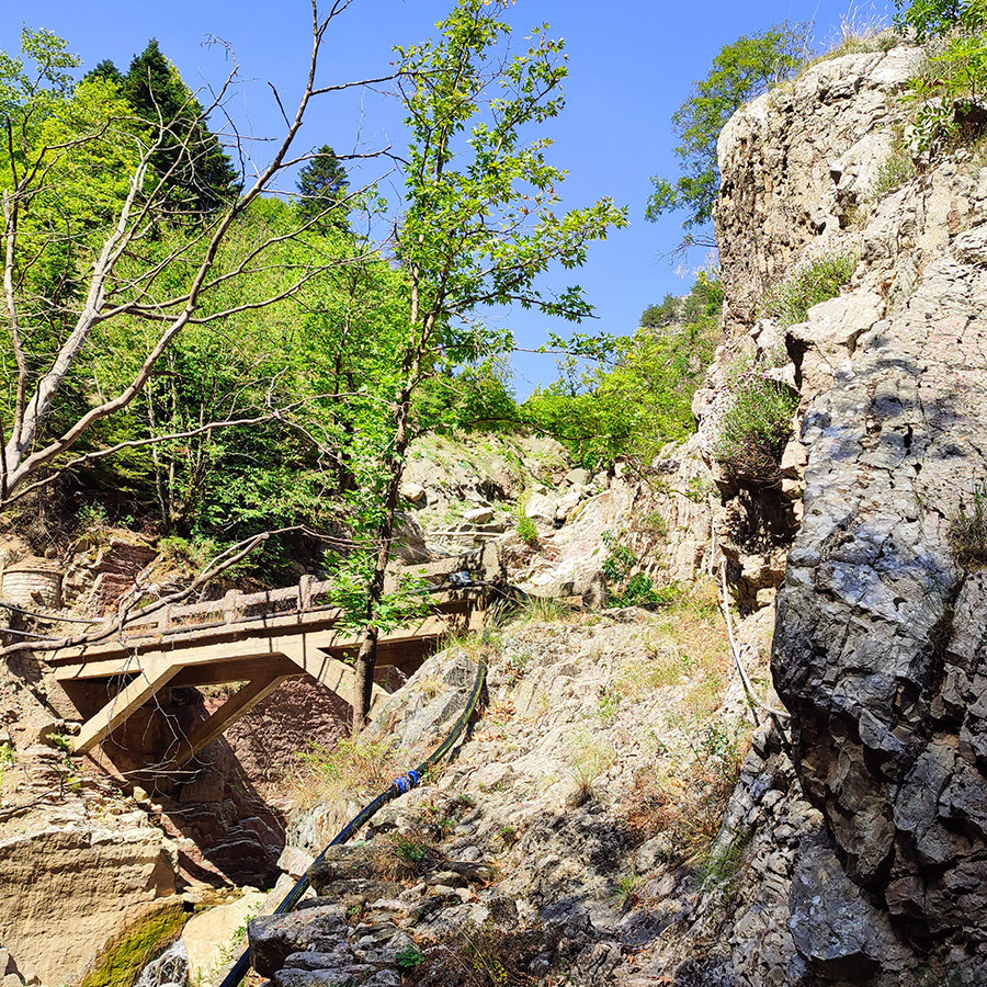 Stone bridge on the Anthochori Waterfall hiking route in Agrafa, Karditsa, Greece