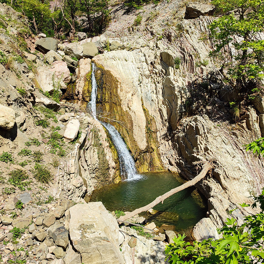 Anthochori Waterfall flowing into a turquoise pool, Agrafa, Karditsa, Greece