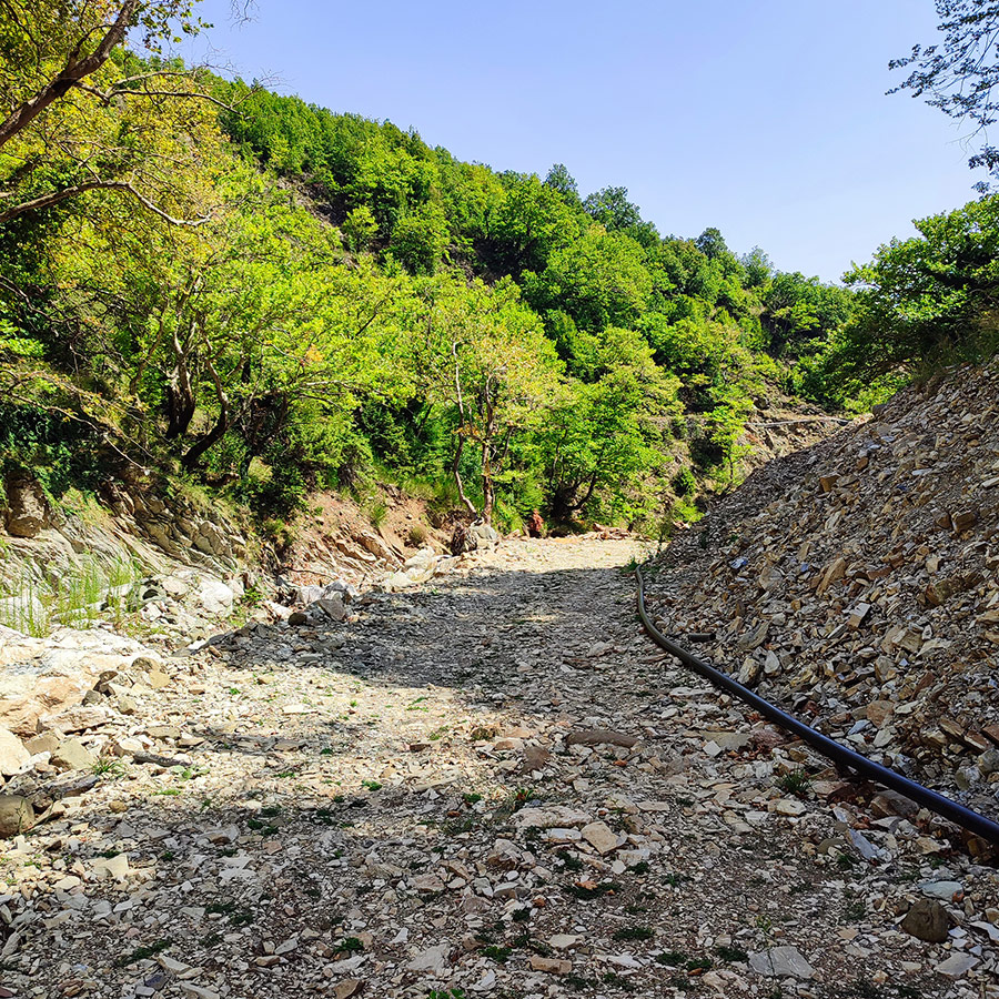 Dry riverbed and hiking trail near Anthochori Waterfall, Agrafa, Greece