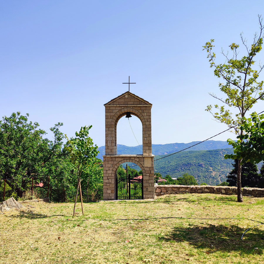 Stone bell tower with cross in Anthochori village, Agrafa, Karditsa, Greece
