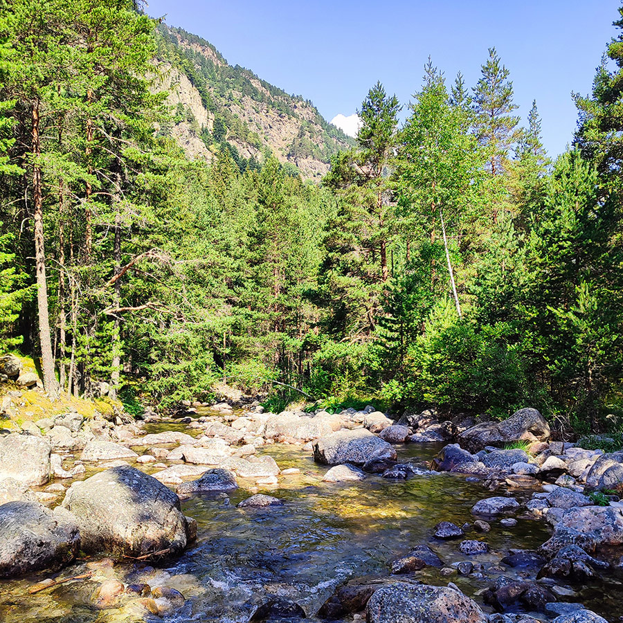 Rocky river with mountain backdrop on the Beli Iskar Eco Trail in Bulgaria