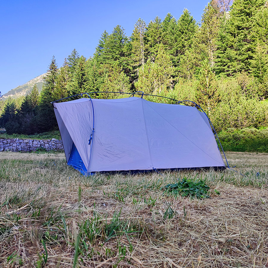 Sierra Designs Flash 3 tent near pine forest at Banderitsa Camping, Pirin National Park.