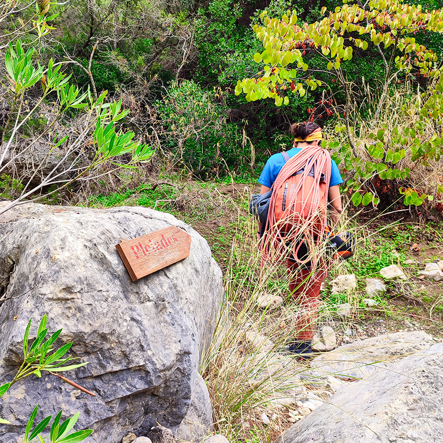 Wooden Pleiades Crag sign marking the path to the Asterope route in Katafyki Gorge.