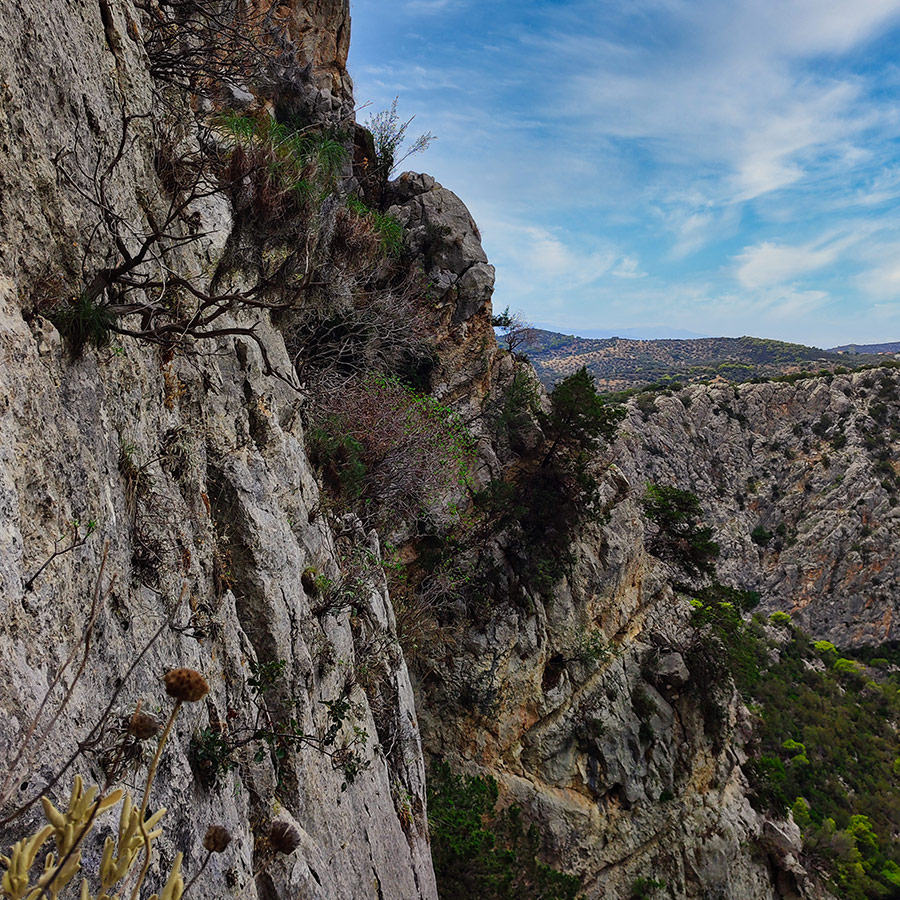 Steep limestone wall and exposure from Asterope route overlooking Katafyki Ravine.