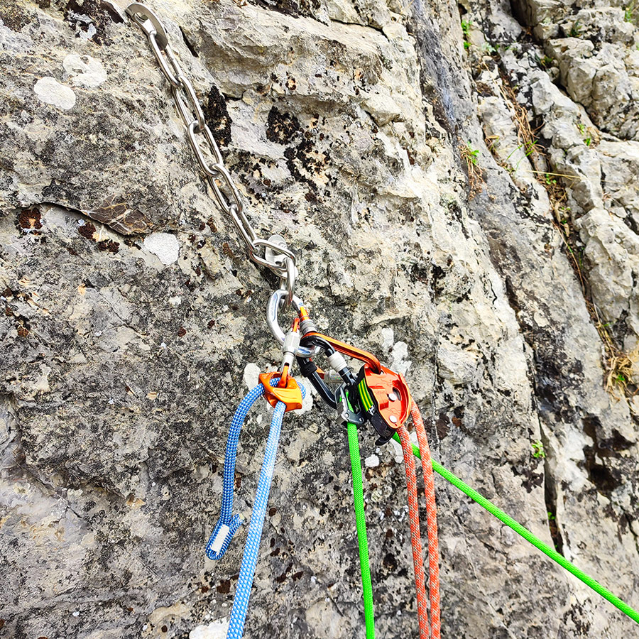 Stainless-steel chain anchor and belay setup on Asterope route in Katafyki Gorge.