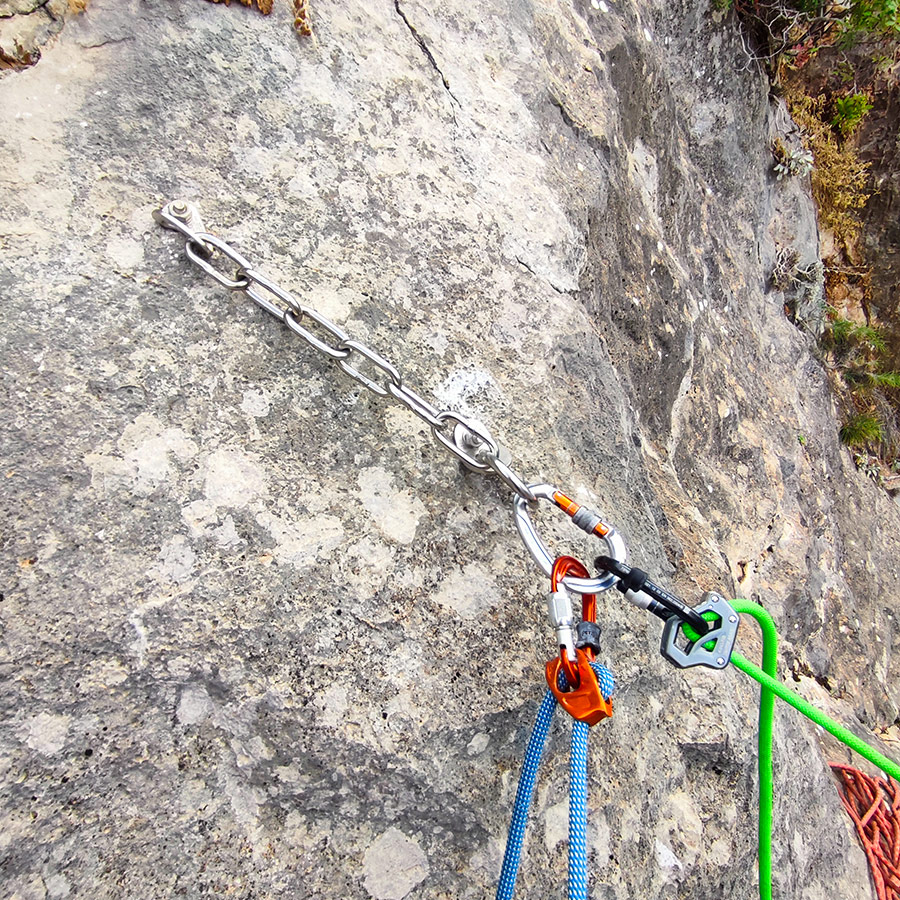 Stainless steel anchor chain setup on the upper belay station of Asterope.
