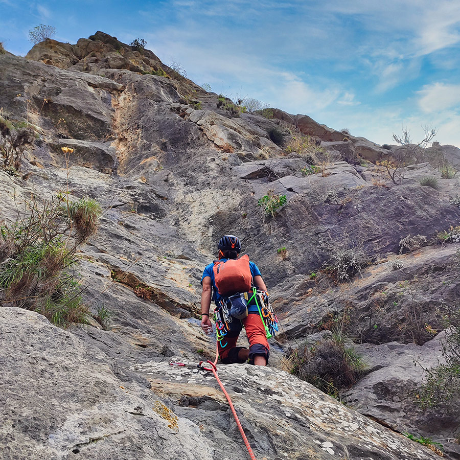 Lead climber preparing for the fourth pitch of Asterope on Pleiades Crag, Ermioni.