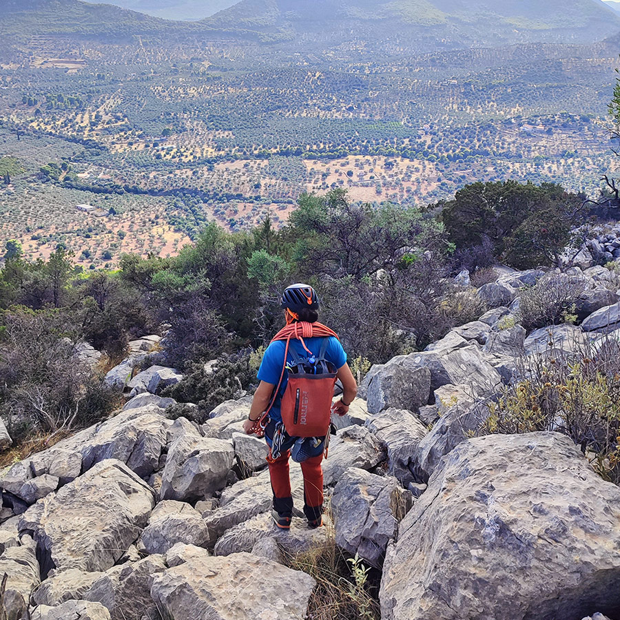 Climber beginning the descent path from Pleiades Crag after completing Asterope route.