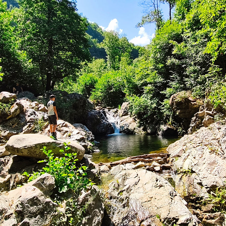 Wide view of Kapejnci Waterfall and natural swimming pool near Bitola