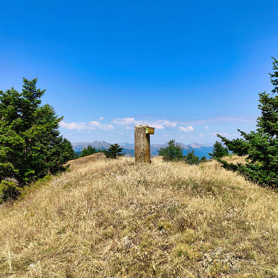 Summit marker on Voulgara Peak at 1,654 meters in the Agrafa Mountains.