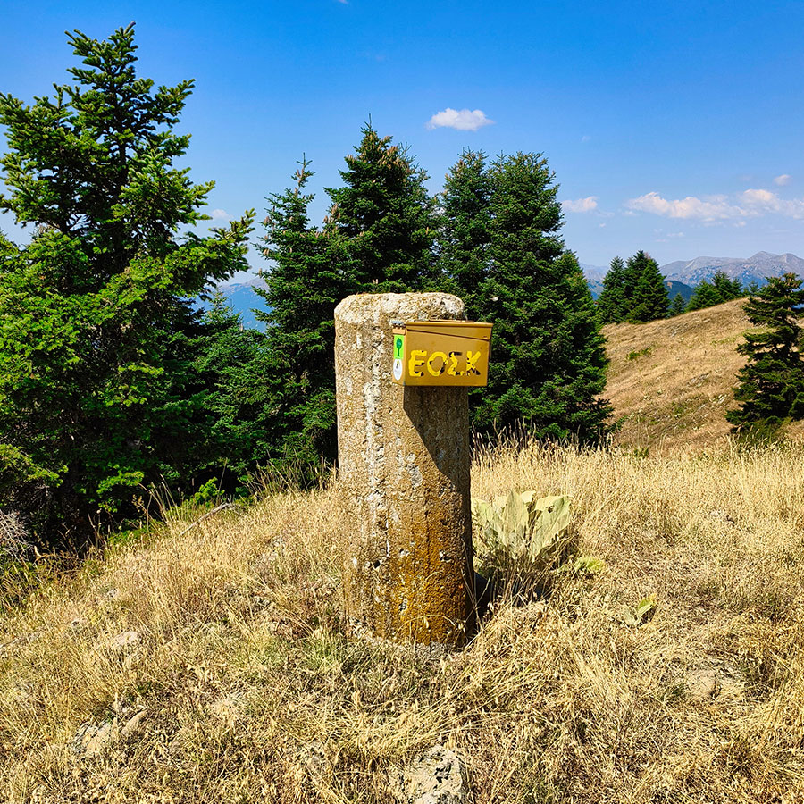 Summit trig point of Voulgara Peak with EOSX mailbox in the Agrafa Mountains.